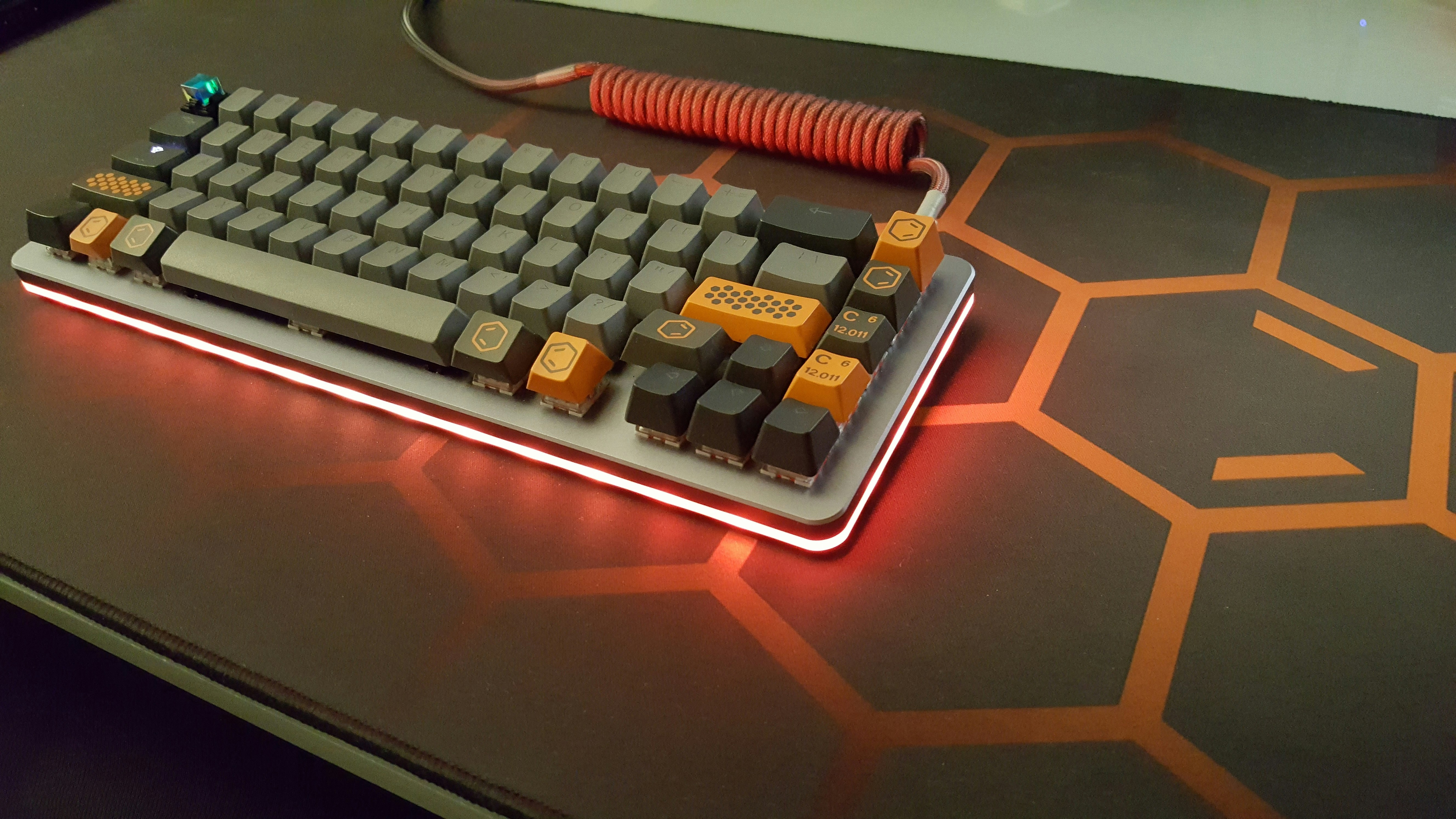 GMK Carbon Novelty keycaps, now complete with themed desk mat and